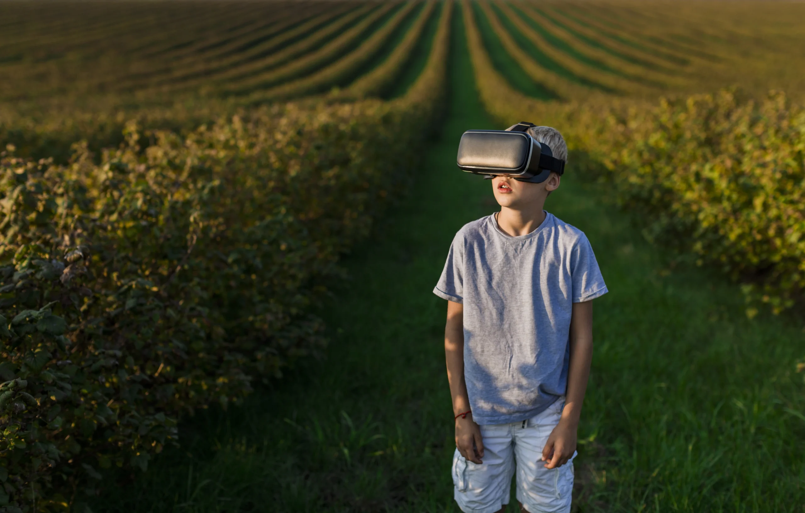 lovely little boy having fun with virtual reality glasses